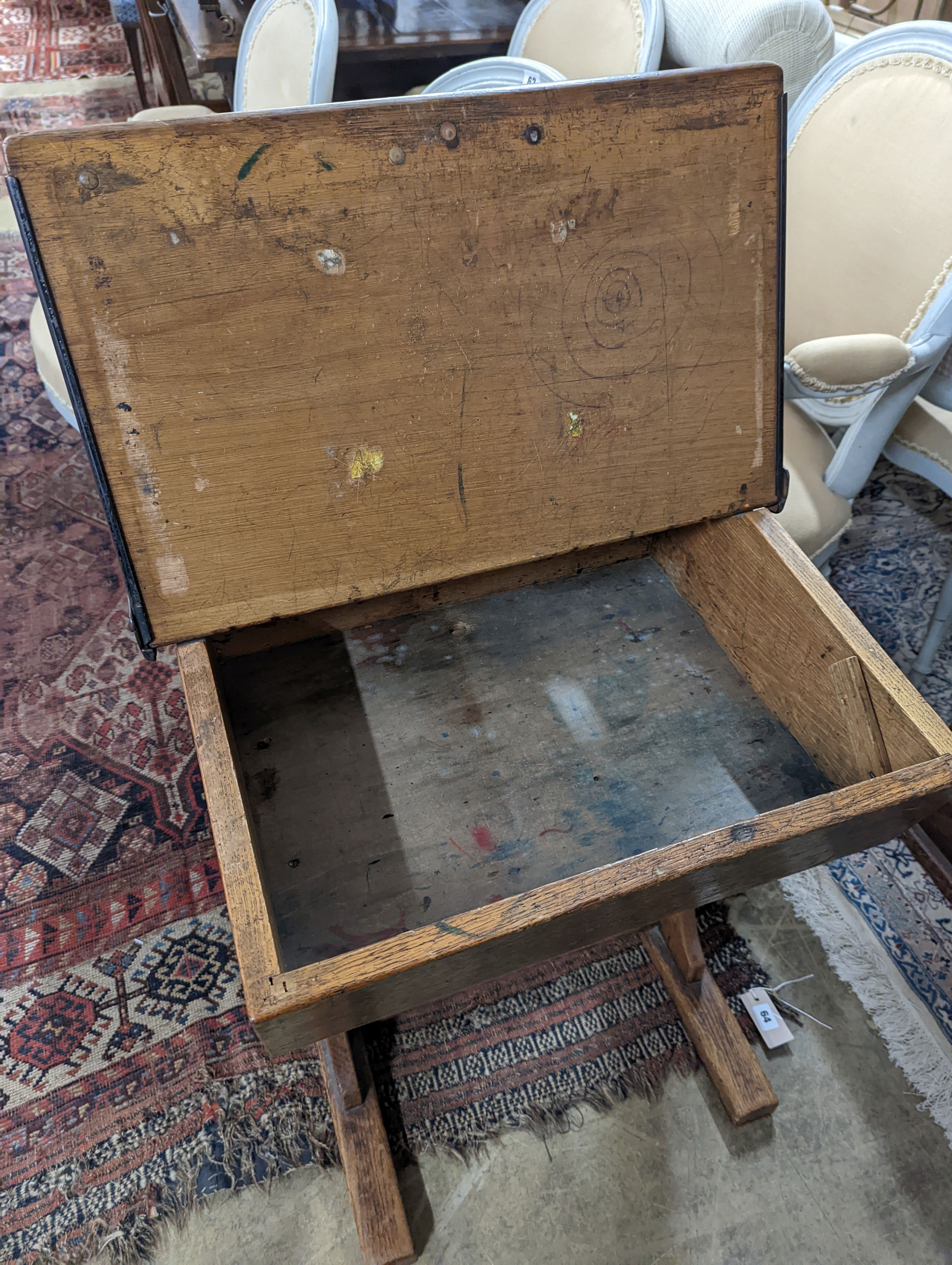 A vintage oak student's desk, width 57cm, depth 46cm, height 71cm with an elm and beech chair